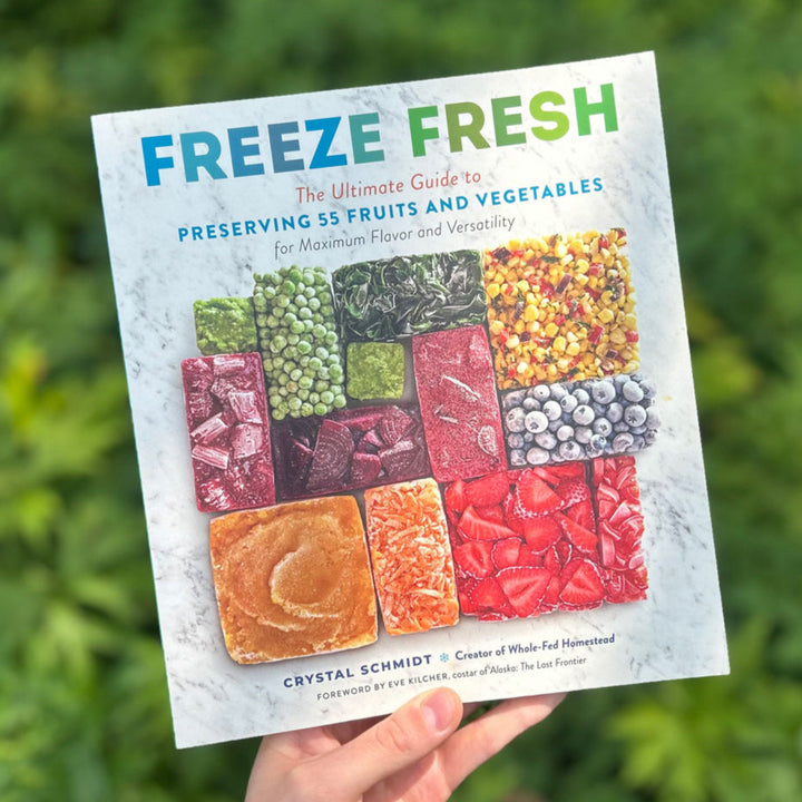 Book titled 'Freeze Fresh' held in front of a green background