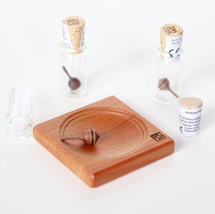 Lilliput spinning top in glass