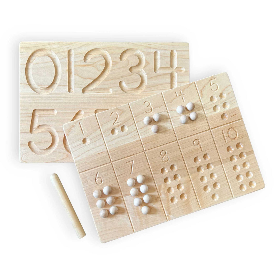 Wooden educational board with numbers and pegs on a white background