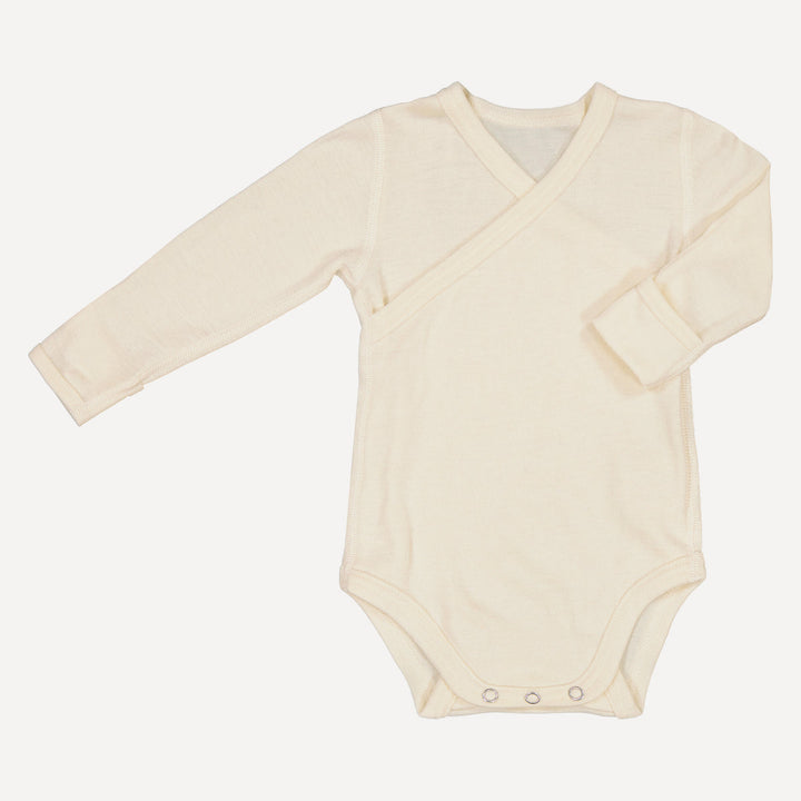 Organic silk and wool blend baby wrap bodysuit on a white background