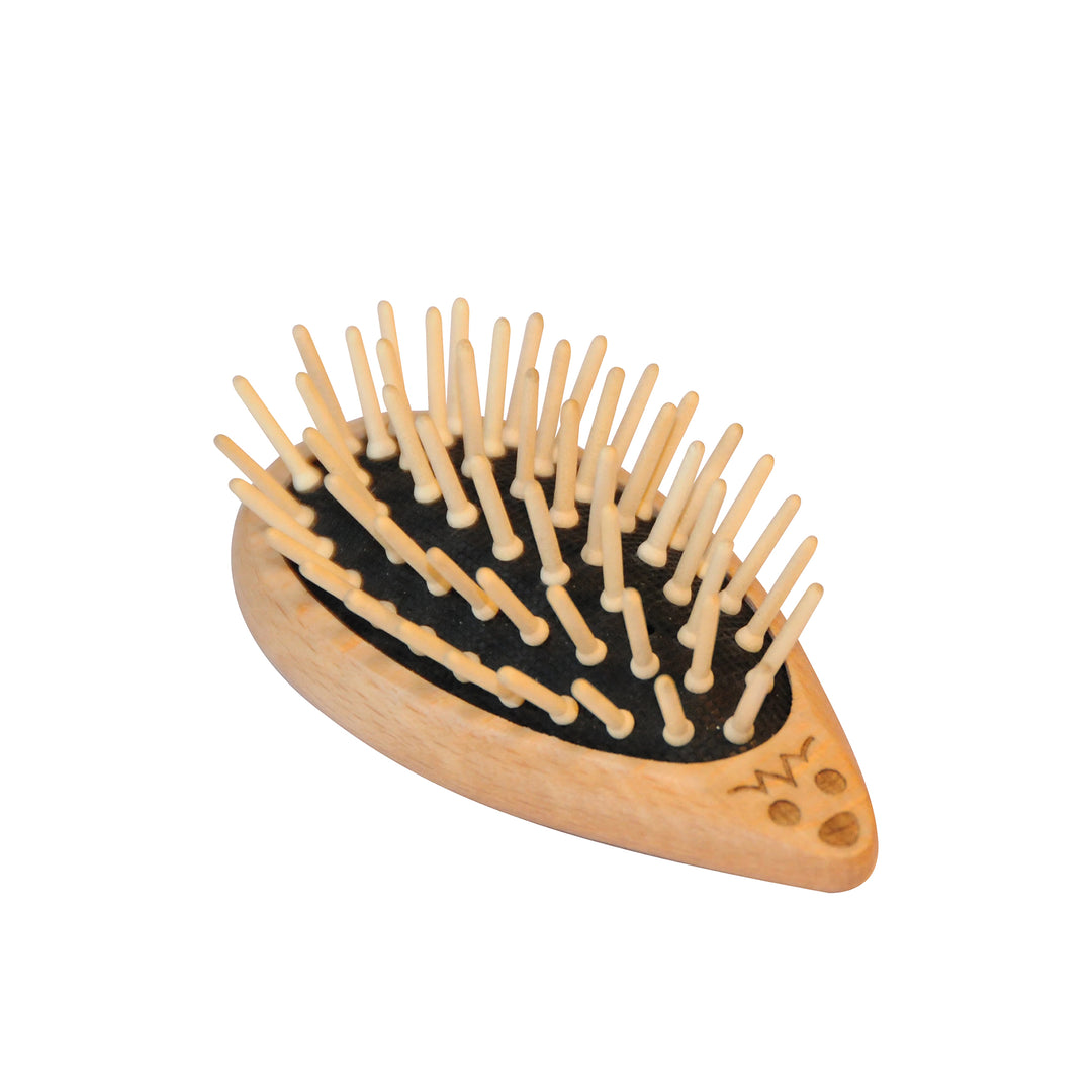 Hedgehog motif wooden hairbrush with wooden peg bristles on a white background