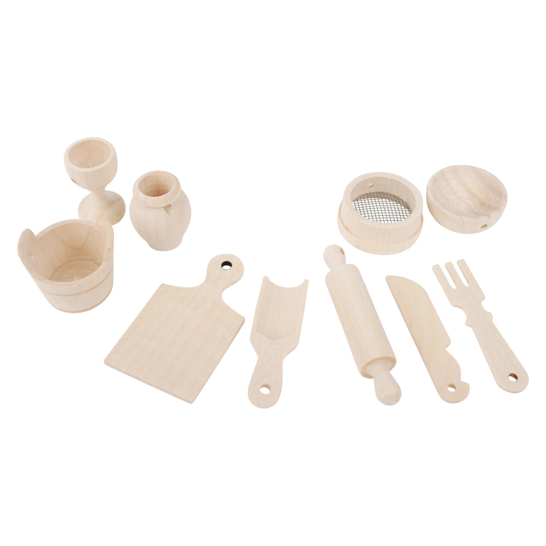 Set of wooden dollhouse sized kitchen utensils on a white background
