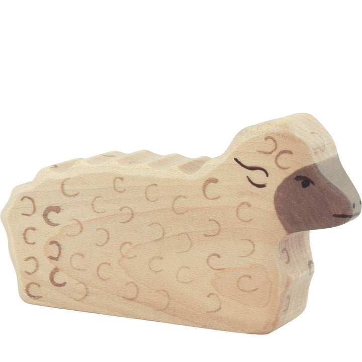 Holztiger sheep lying