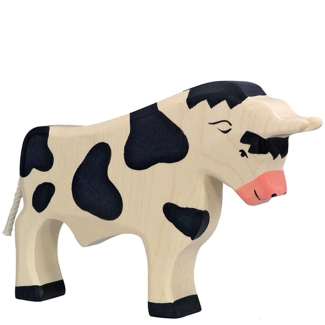 Holztiger brand wooden cow toy with black and beige pattern on a white background
