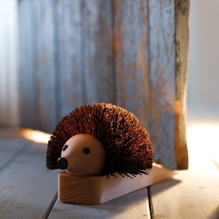 shoe-cleaning hedgehog doorstop