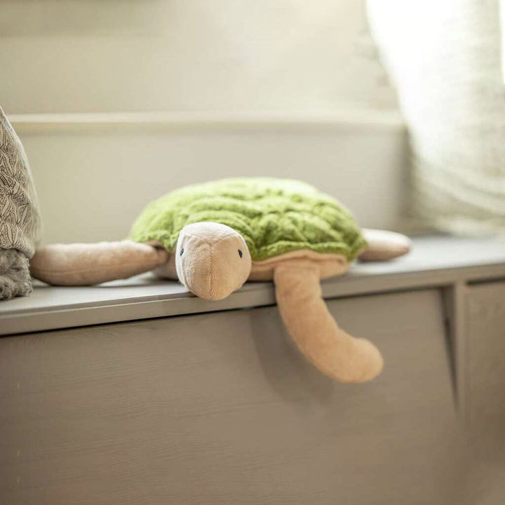 cuddly green turtle with warming inlet