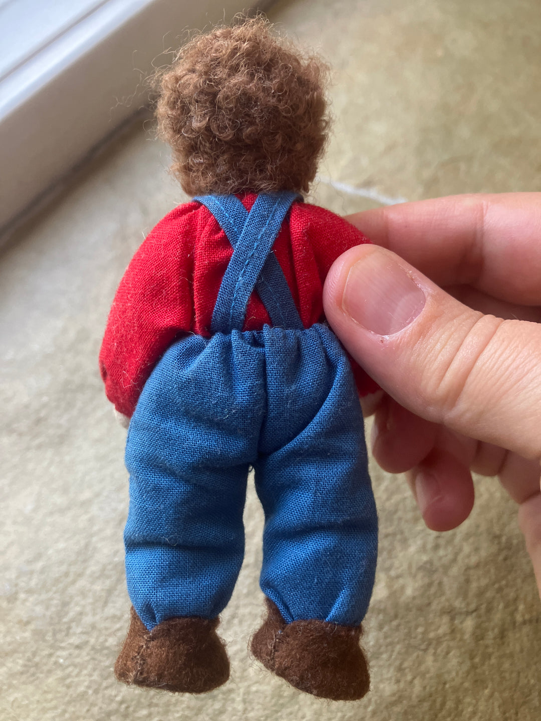Grimm's dollhouse doll, brunette with pants and suspenders (gently played)