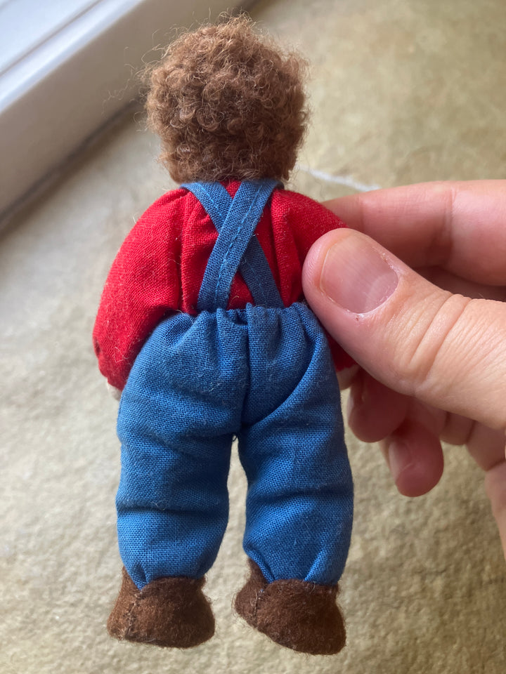 Grimm's dollhouse doll, brunette with pants and suspenders (gently played)