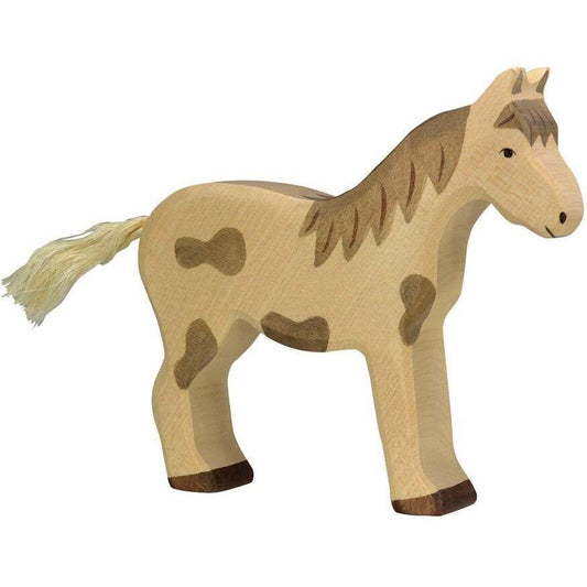 Holztiger horse standing, dappled